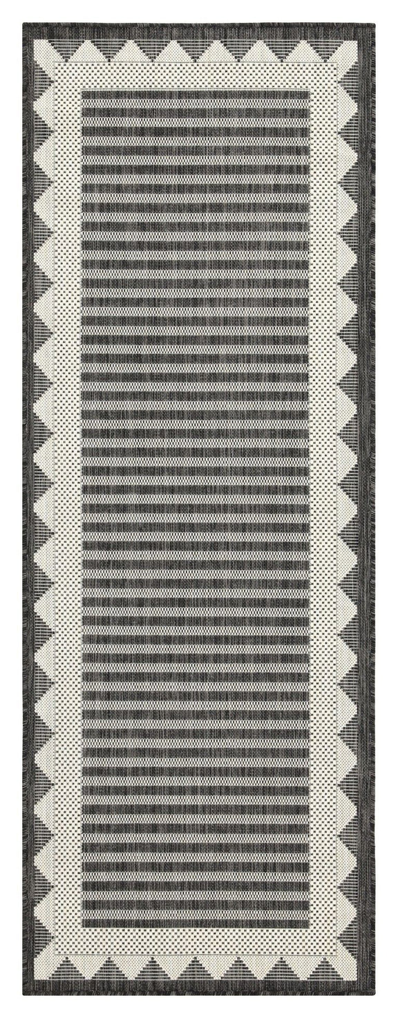 Dark gray striped area rug with cream zigzag border and vertical striped center
