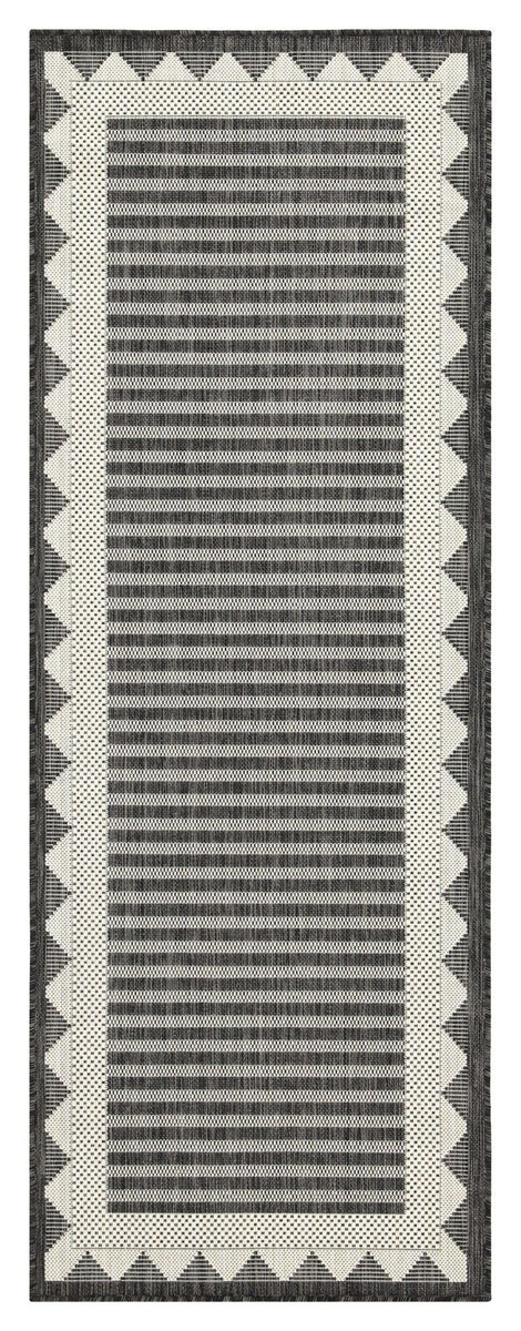 Dark gray area rug with vertical horizontal stripe texture and cream zigzag border