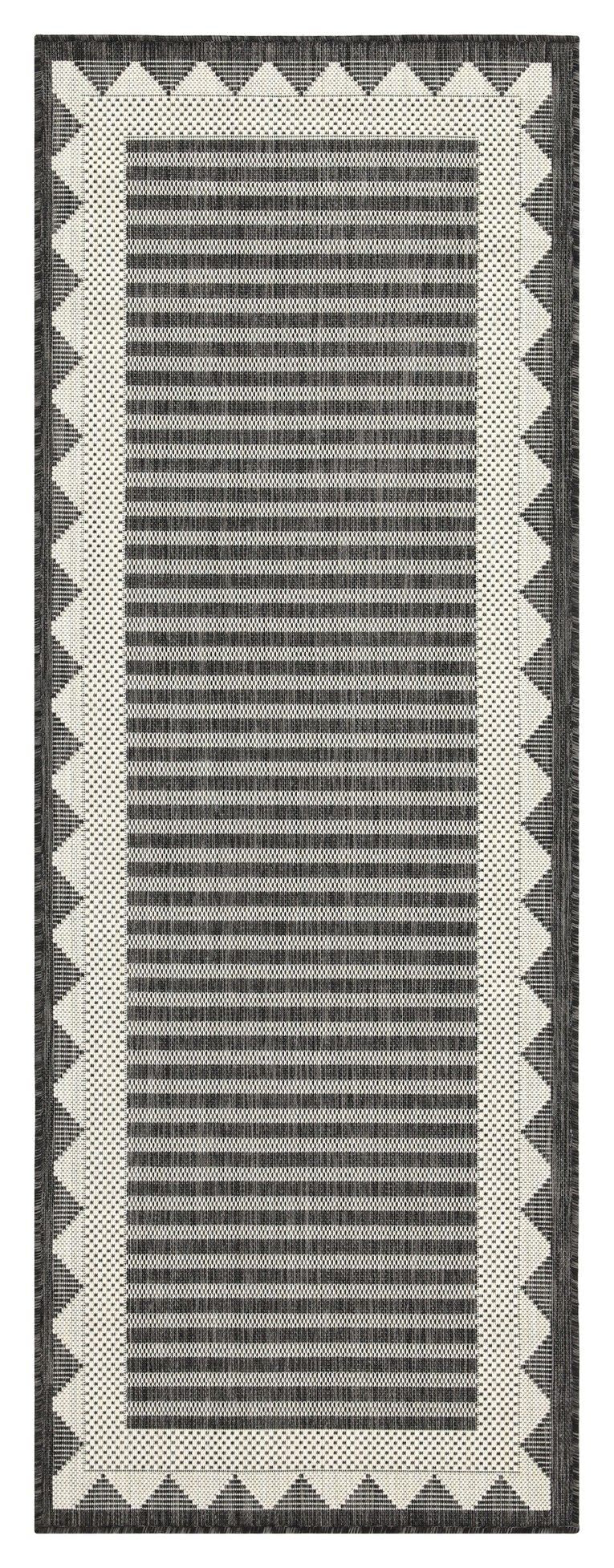 Dark gray area rug with vertical horizontal stripe texture and cream zigzag border