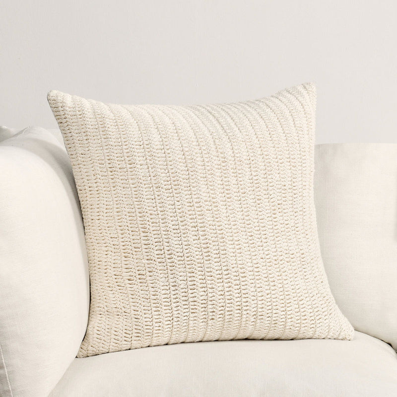 Ivory textured knit square pillow with raised stitched pattern
