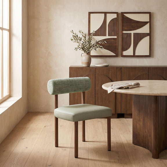 Green upholstered dining chair with chenille back and vegan leather seat, wood legs.