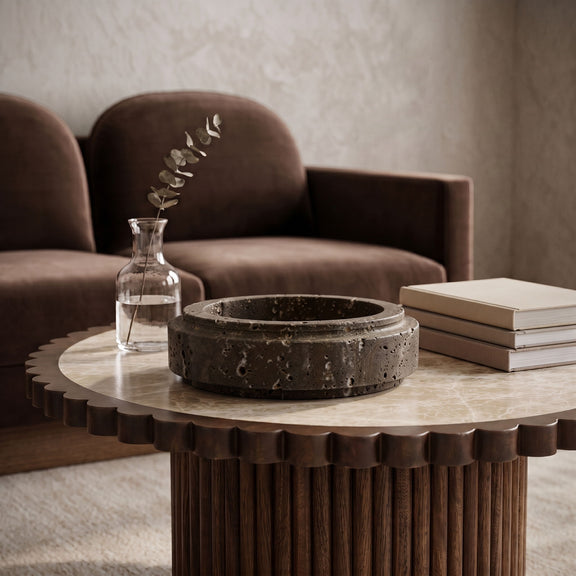 Parsons travertine bowl in dark gray, speckled exterior on tabletop