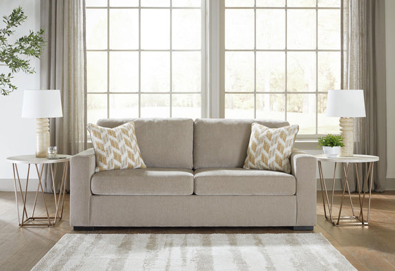 Bridgepoint sofa in light beige fabric with two seat cushions and two patterned pillows