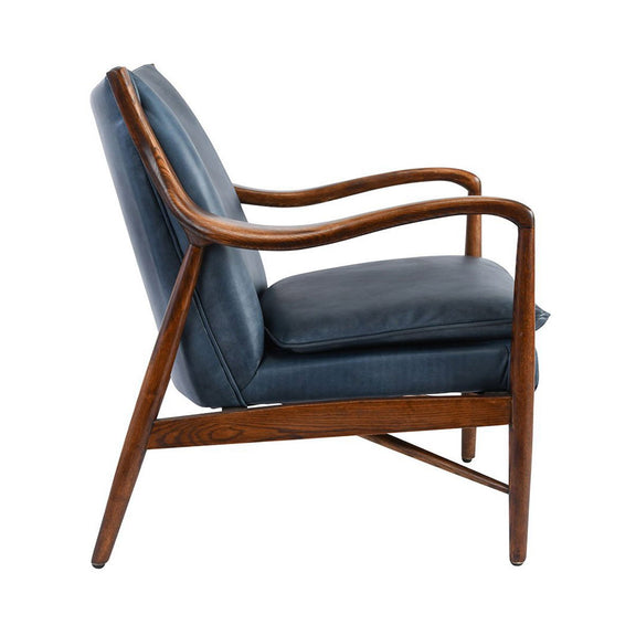 Kiannah club chair side view with blue upholstery, curved wood arms and angled front legs