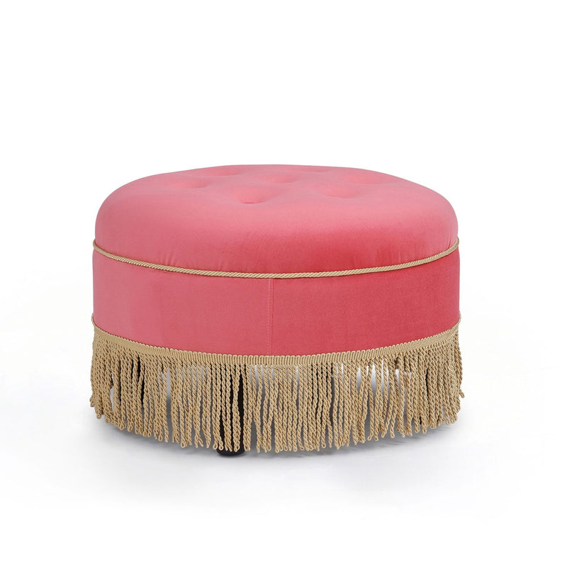 Round upholstered accent ottoman with pink cushion and gold fringe trim