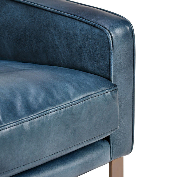 Ocean blue upholstered arm and seat cushion with stitched seams