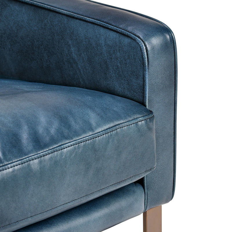 Ocean blue upholstered arm and seat cushion with stitched seams