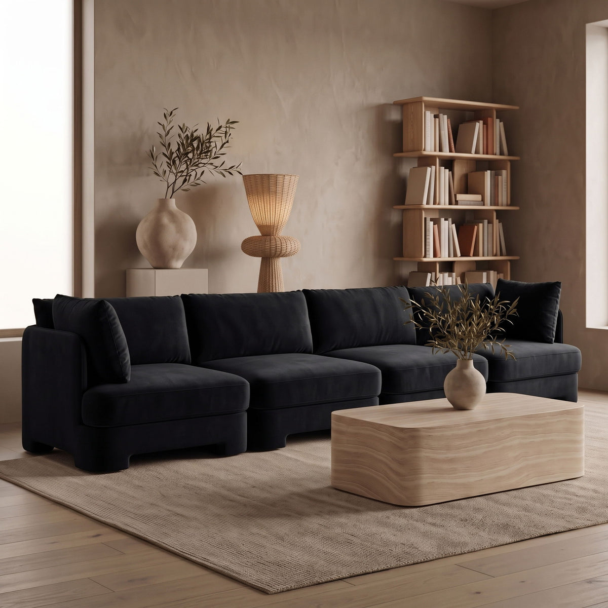 Black velvet performance fabric modular sectional sofa with deep cushions and back pillows