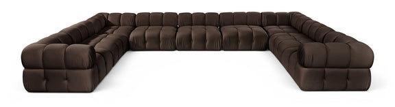 Dark brown velvet upholstered sectional sofa with tufted cushions and curved end arms