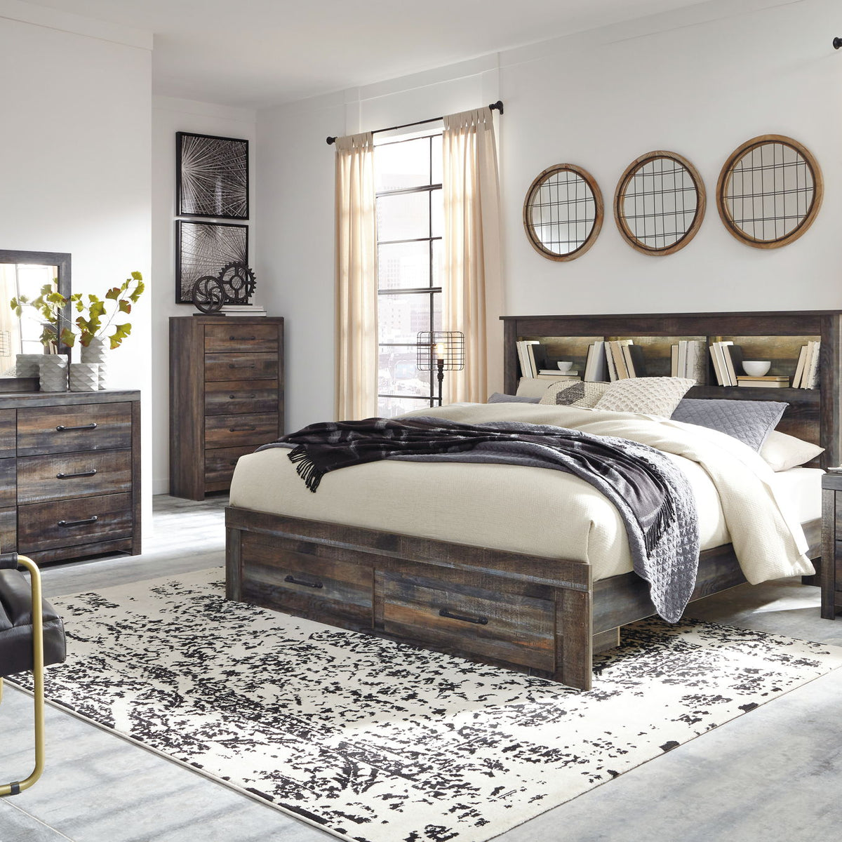 Panel bookcase bed in dark wood with two drawers and bookcase headboard, layered bedding