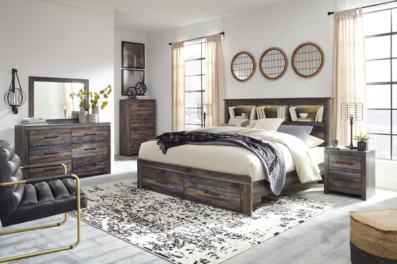 Panel bookcase bed in dark wood with two drawers and bookcase headboard, layered bedding
