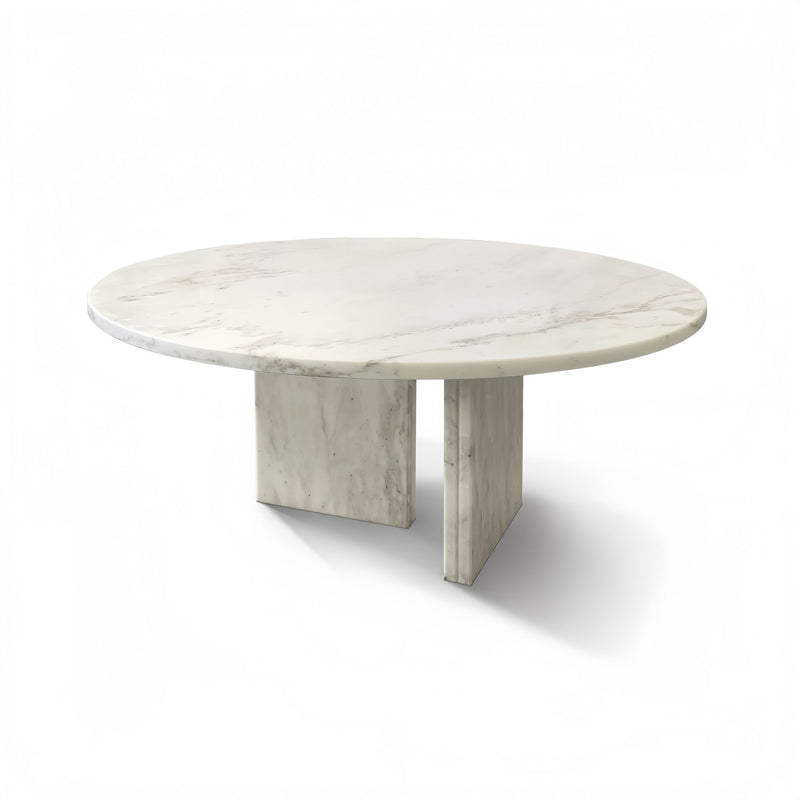 Round white marble-look coffee table with subtle gray veining and boxy leg base