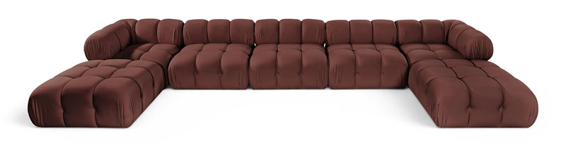 Burgundy modular sectional sofa with tufted cushions and rounded armrests, curved seating