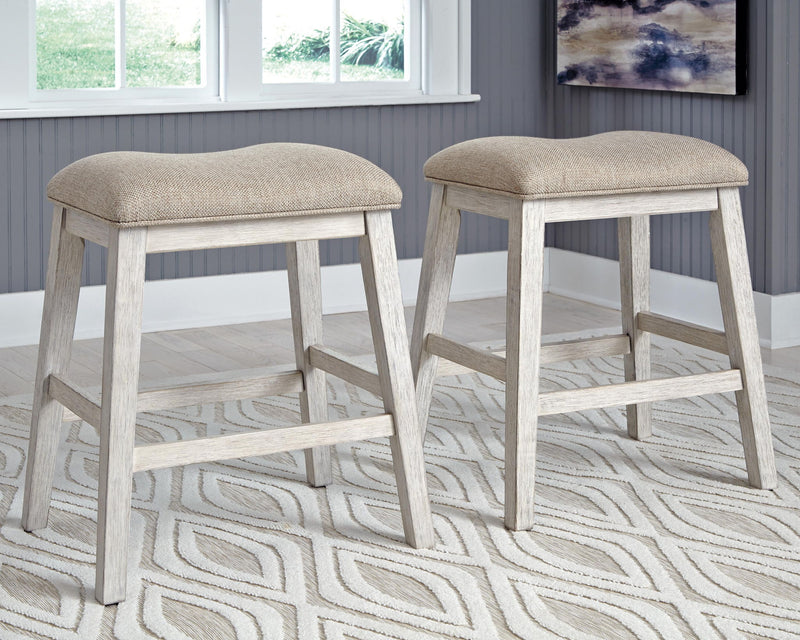 Set of 2 upholstered bar stools with light beige seats and weathered gray legs