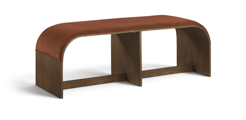 Rust brown velvet upholstered bench with curved back and wooden base