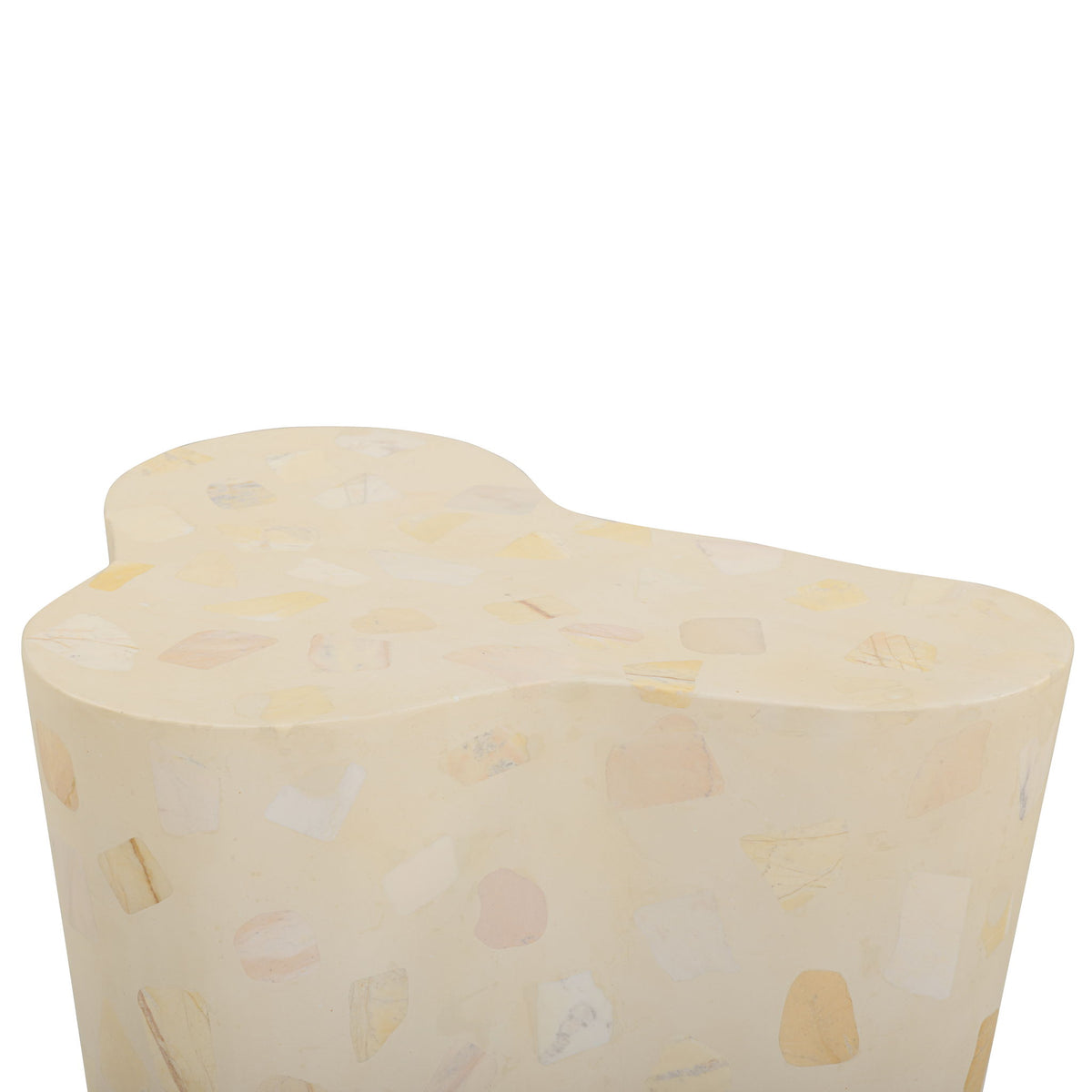 Beige terrazzo-pattern side table with curved body and rounded top
