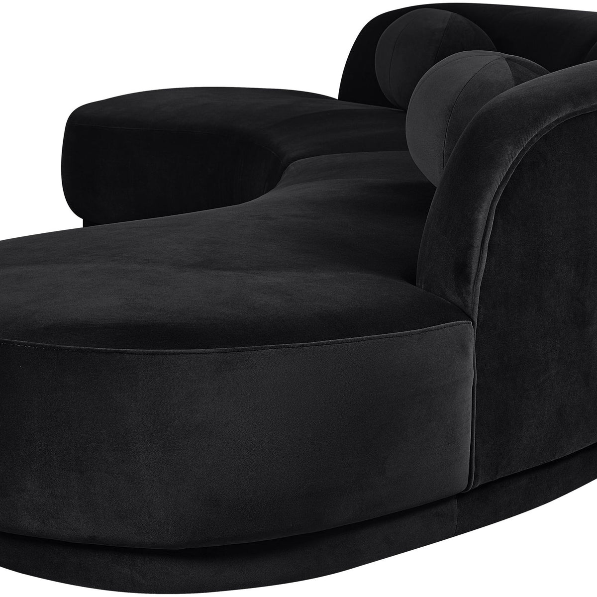 Black velvet sectional sofa with curved armrest and chaise-style seat