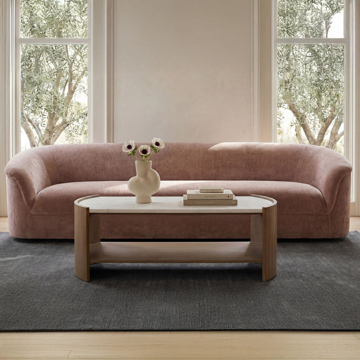 Coffee table with white top and light brown wood frame, open lower shelf.