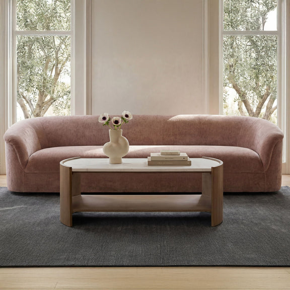Coffee table with white top and light brown wood frame, open lower shelf.
