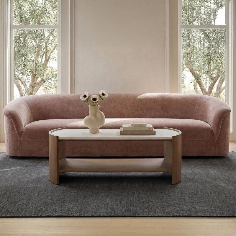 Coffee table with white top and light brown wood frame, open lower shelf.