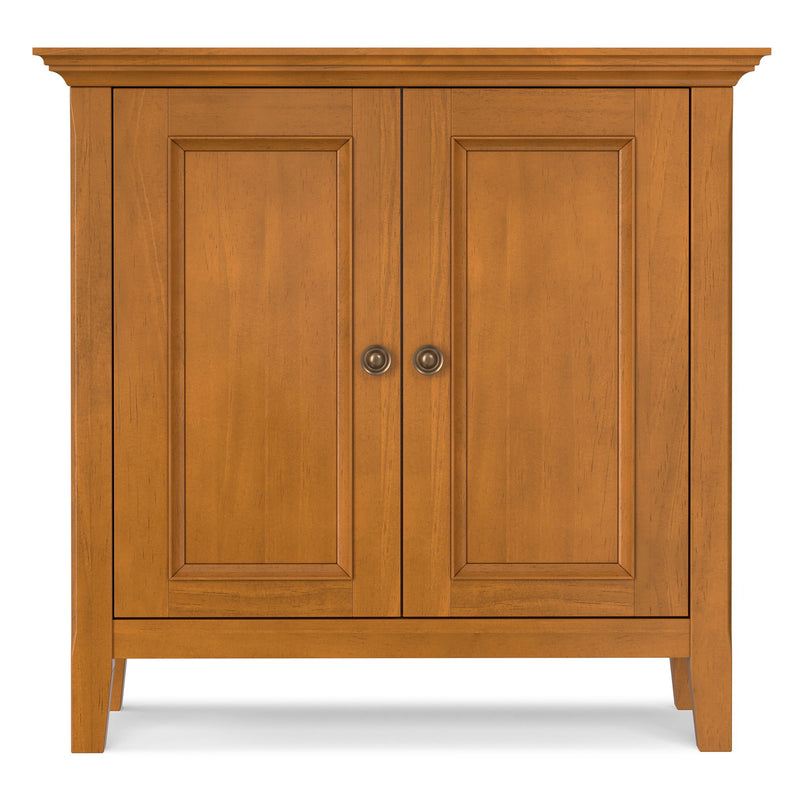 Low storage cabinet with two wood doors, raised panels, and round knobs