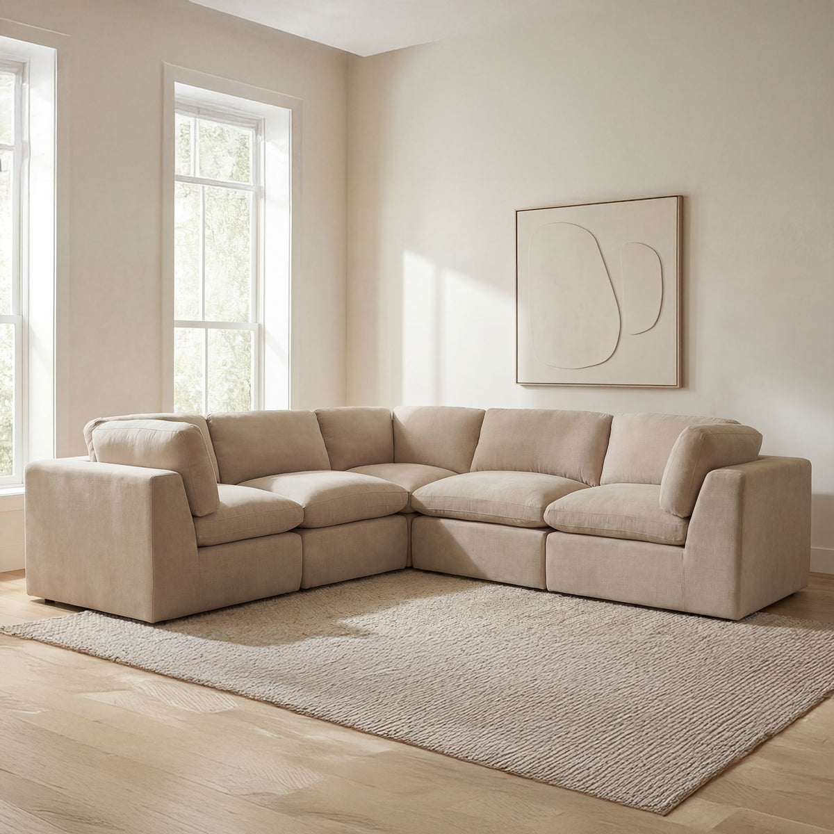 Light beige corner sectional sofa with square arms and layered seat cushions