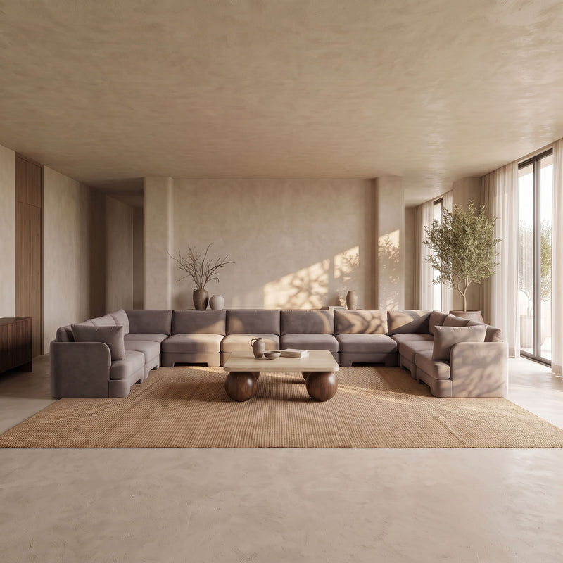 Beige velvet sectional sofa with modular chaise and padded back cushions