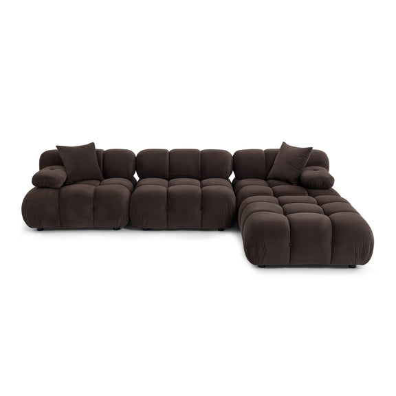 Dark brown modular sectional sofa viewed from side, showing chunky box cushions and rounded chaise