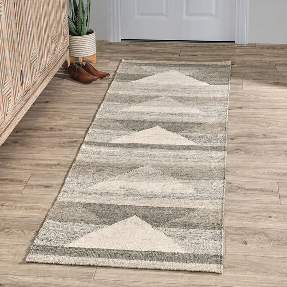 Gray indoor/outdoor runner rug with cream and charcoal triangle geometric pattern