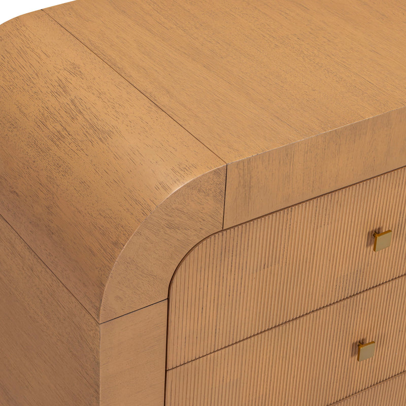 Close-up of light brown dresser corner with curved trim and striped drawer fronts