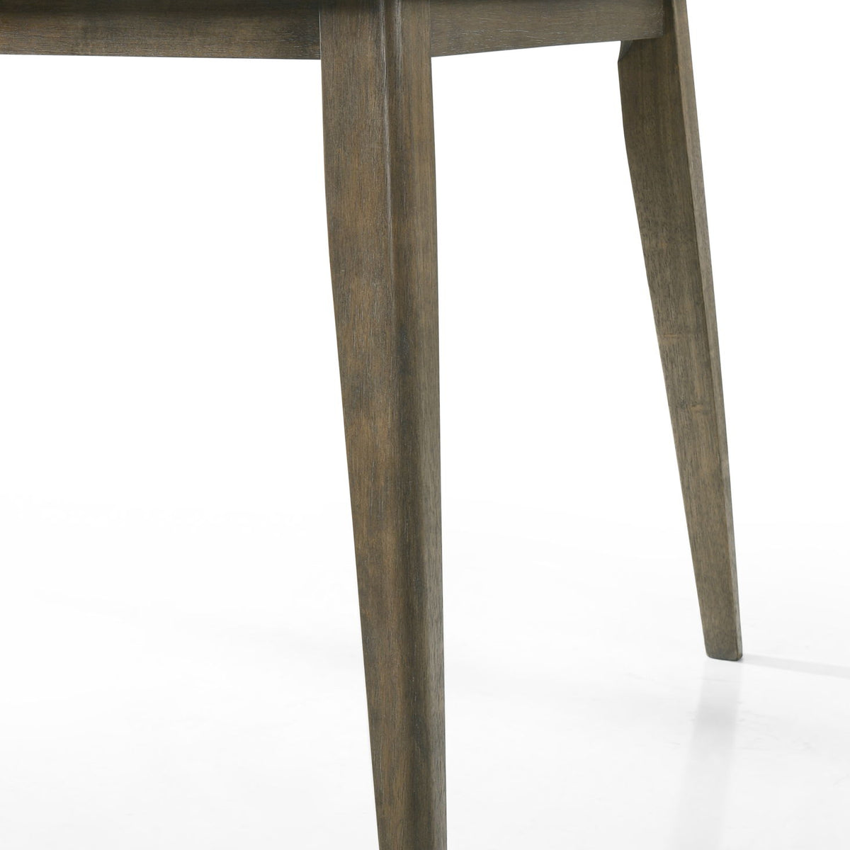 Close-up of dark brown dining table leg with tapered profile
