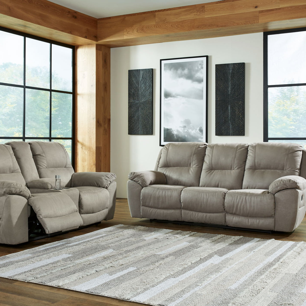 Putty reclining sofa and loveseat set with padded arms and multiple recline positions