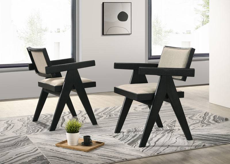 Ebony black arm chairs with light beige cushions and round console table