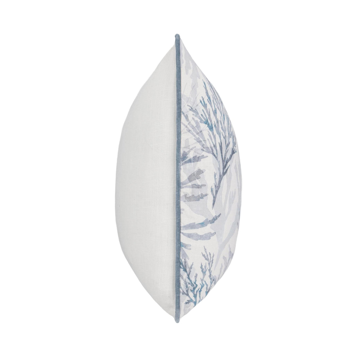 Decorative pillow side profile with white fabric and blue botanical panel, blue piping