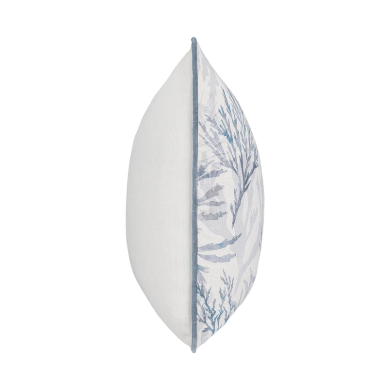 Decorative pillow side profile with white fabric and blue botanical panel, blue piping