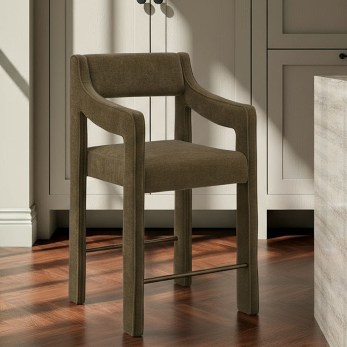 Cedar green upholstered counter stool with tall backrest, thick legs, and front footrest bar