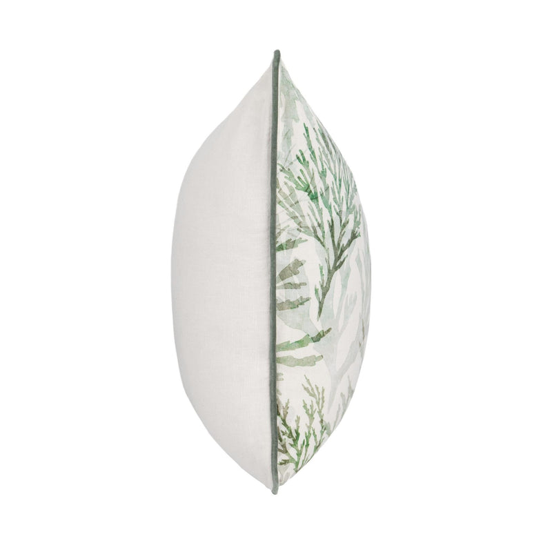 Decorative pillow side profile with white fabric and green botanical panel, green piping