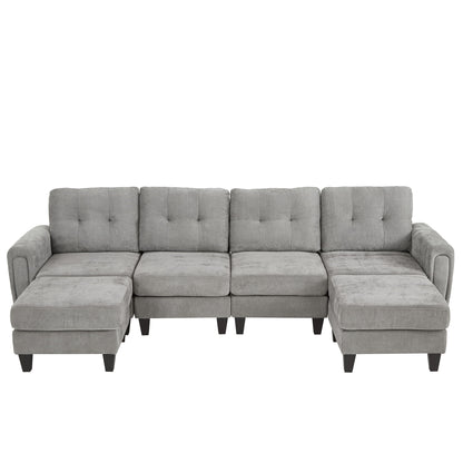 Dark gray modular sectional sofa with tufted cushions and movable ottomans