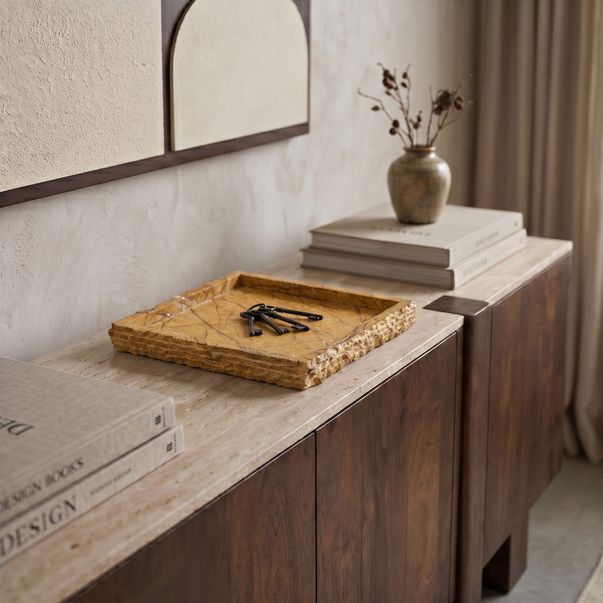 Genuine marble tray on a console, rectangular rim, golden tan stone with veining.