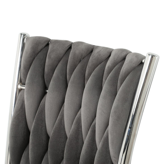Dark gray tufted dining chair backrest with diamond stitch and chrome trim