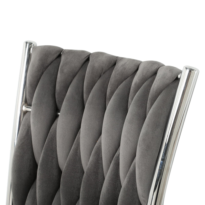 Dark gray tufted dining chair backrest with diamond stitch and chrome trim