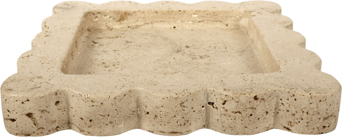 Natalie travertine tray side profile; pale beige stone with scalloped edges.