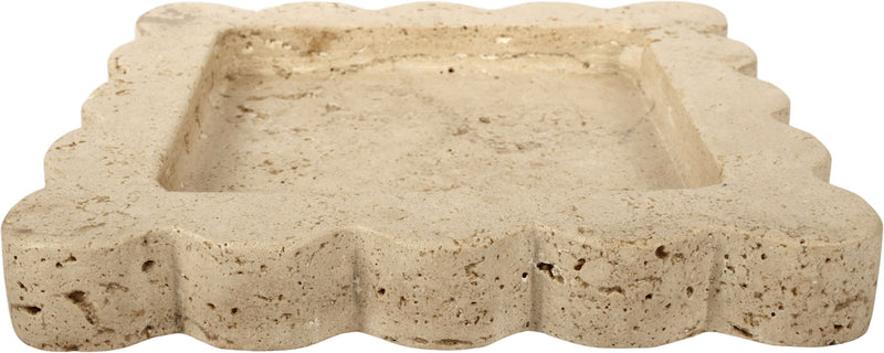 Natalie travertine tray side profile; pale beige stone with scalloped edges.