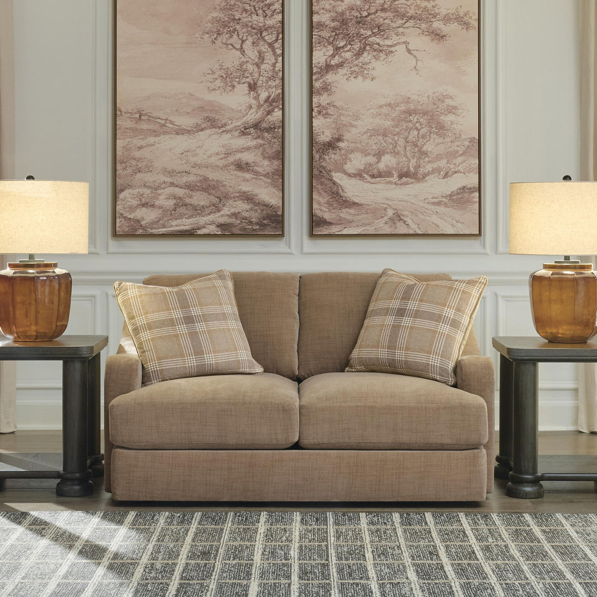 Beige loveseat with plaid accent pillows and solid back cushions