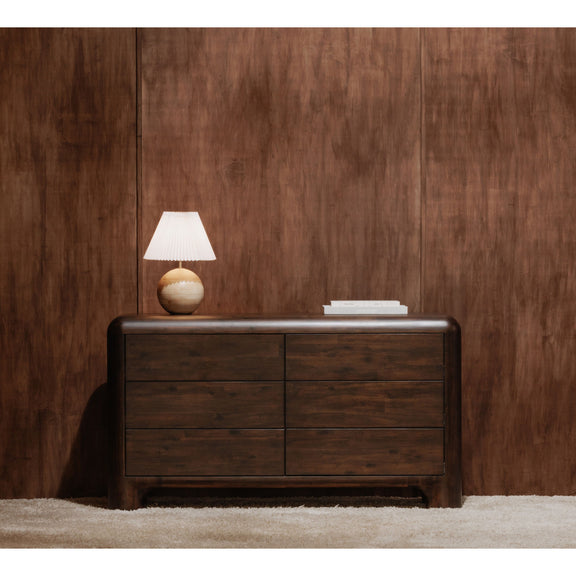 Dark brown six-drawer dresser with lamp on top and four visible drawer fronts