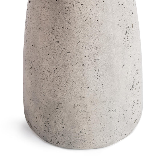 Outdoor accent table, light gray speckled concrete lower pedestal close-up