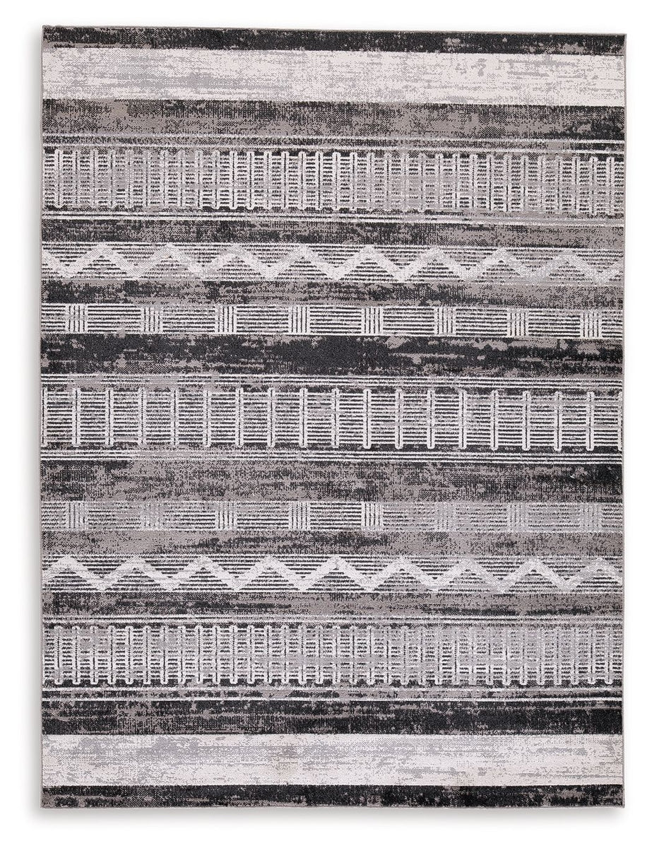Multi-pattern area rug, abstract stripes and grids in gray and light tones