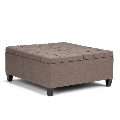 Upholstered storage ottoman coffee table with tufted top in light brown fabric