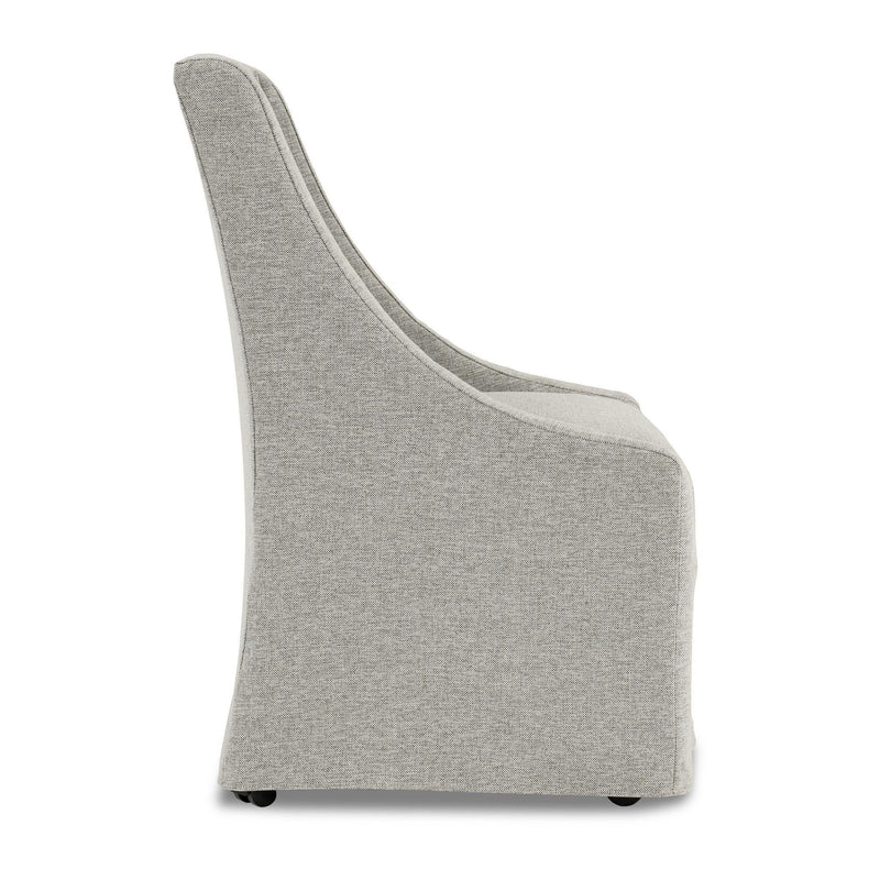 Gray upholstered rolling dining chair, side view, with curved arms and casters.
