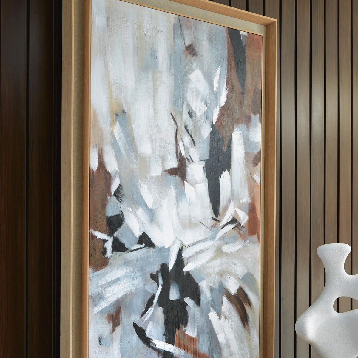 Framed abstract wall art featuring white, black, and tan textured strokes